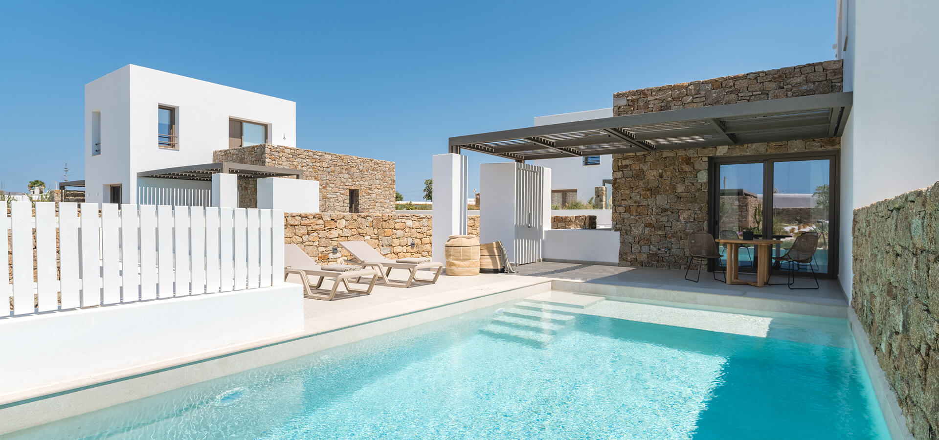 Suite with private pool on a bright summer day